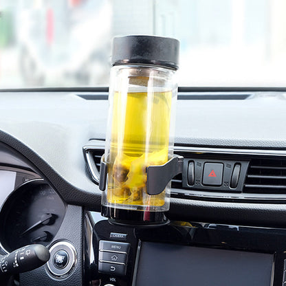 Monitoiminen mukiteline autoon