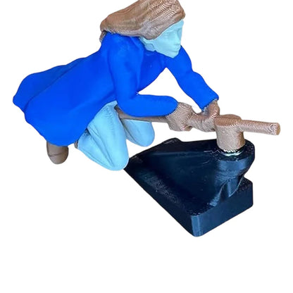 Maaginen luudanvarsikoriste auton kojelaudalle